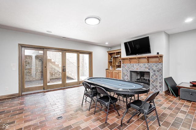 4181 Whitetail Woods Dr, Bargersville, IN 46106 - game room with a fireplace, baseboards, and recessed lighting