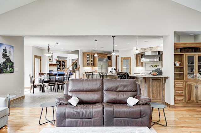 4181 Whitetail Woods Dr, Bargersville, IN 46106 - living room featuring light wood-type flooring, stairs, ornamental molding, recessed lighting, and high vaulted ceiling