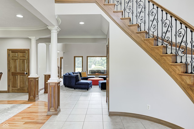 4181 Whitetail Woods Dr, Bargersville, IN 46106 - foyer featuring light tile patterned floors, baseboards, crown molding, recessed lighting, and ornate columns