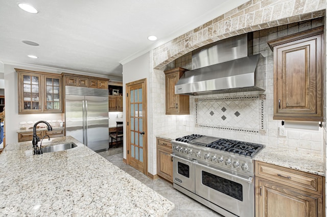4181 Whitetail Woods Dr, Bargersville, IN 46106 - kitchen with premium appliances, wall chimney exhaust hood, a sink, french doors, and crown molding