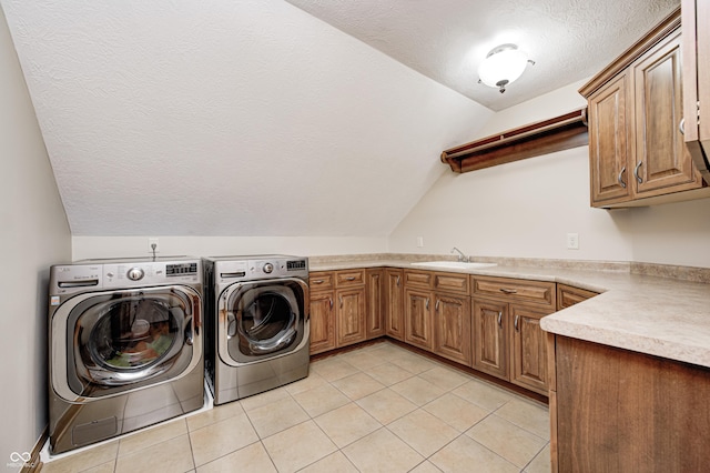 4181 Whitetail Woods Dr, Bargersville, IN 46106 - laundry room featuring a textured ceiling, cabinet space, washing machine and clothes dryer, and light tile patterned flooring