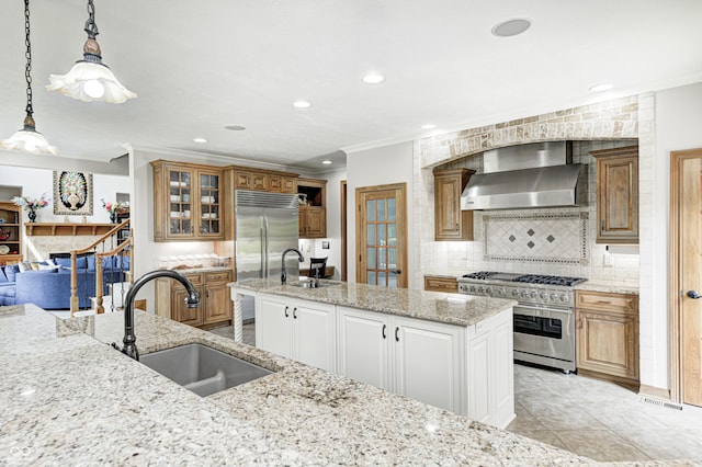 4181 Whitetail Woods Dr, Bargersville, IN 46106 - kitchen with wall chimney exhaust hood, high quality appliances, a sink, backsplash, and crown molding