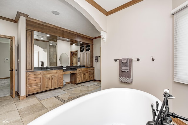 4181 Whitetail Woods Dr, Bargersville, IN 46106 - full bath with ornamental molding, double vanity, a soaking tub, baseboards, and recessed lighting