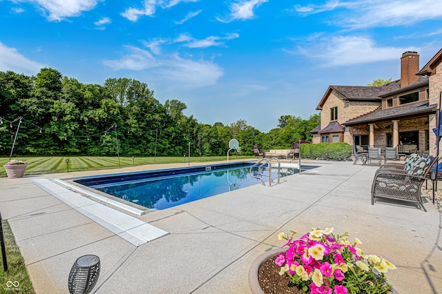 4181 Whitetail Woods Dr, Bargersville, IN 46106 - swimming pool with a patio, a yard, and view of wooded area