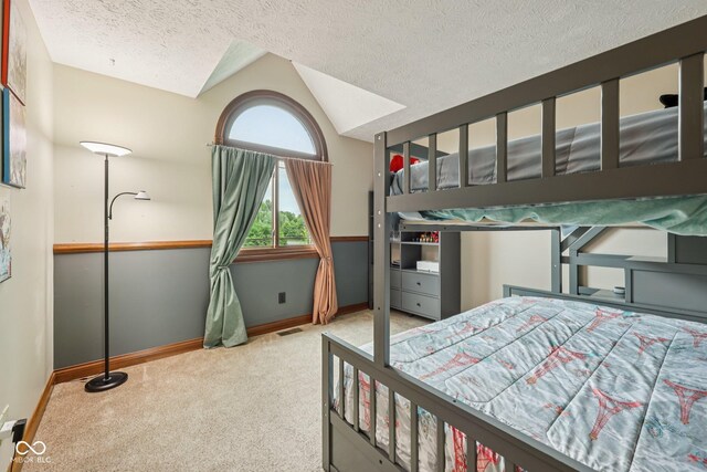 6983 White Oak Dr, Avon, IN 46123 - carpeted bedroom featuring baseboards, a textured ceiling, and vaulted ceiling