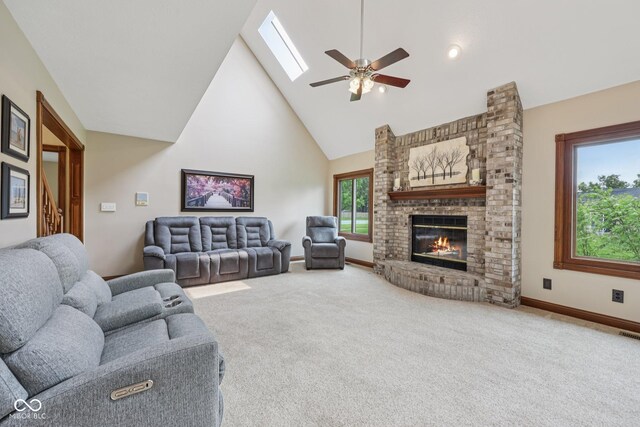 6983 White Oak Dr, Avon, IN 46123 - living area with a ceiling fan, high vaulted ceiling, carpet, a fireplace, and baseboards