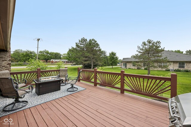 6983 White Oak Dr, Avon, IN 46123 - wooden deck with a lawn and an outdoor fire pit