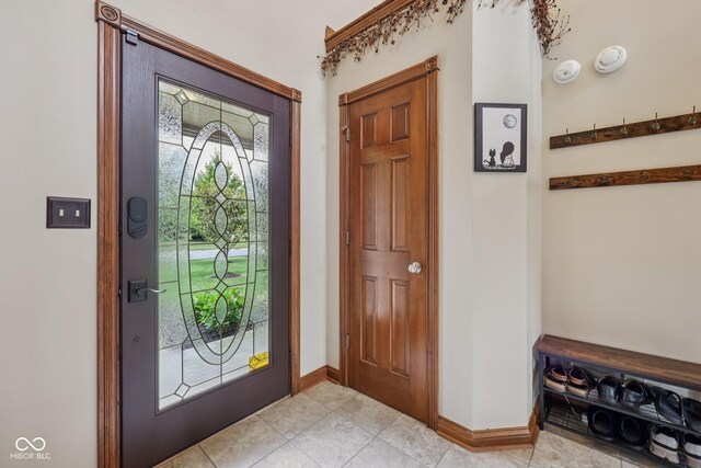 6983 White Oak Dr, Avon, IN 46123 - entryway with baseboards and light tile patterned floors