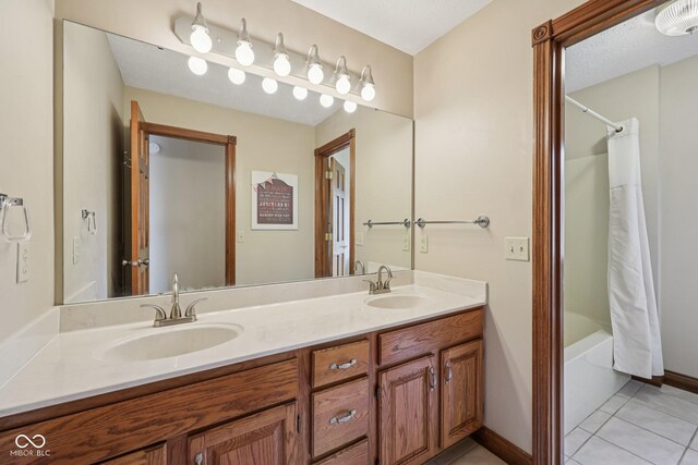 6983 White Oak Dr, Avon, IN 46123 - bathroom with double vanity, tile patterned floors, shower / bathtub combination with curtain, and baseboards