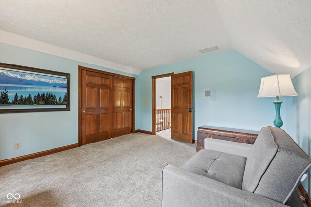 6983 White Oak Dr, Avon, IN 46123 - living area featuring light colored carpet, a textured ceiling, lofted ceiling, and baseboards