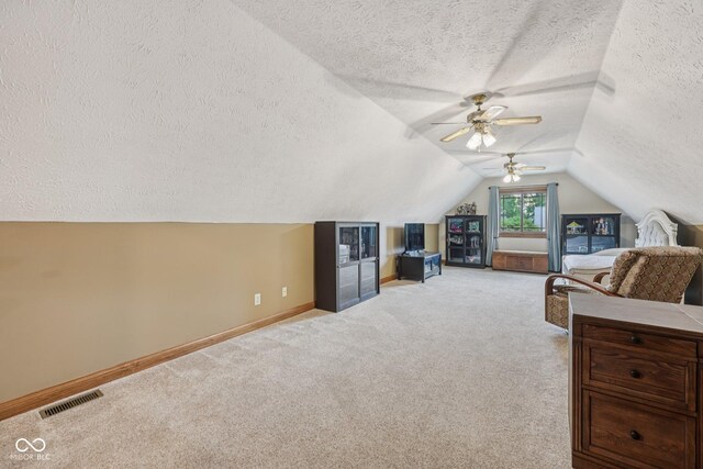 6983 White Oak Dr, Avon, IN 46123 - carpeted bedroom with a textured ceiling, baseboards, lofted ceiling, and ceiling fan