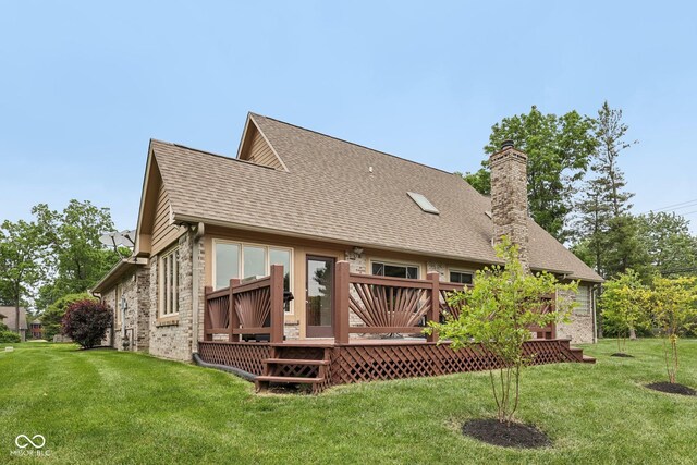 6983 White Oak Dr, Avon, IN 46123 - rear view of property with a chimney, a deck, a lawn, brick siding, and roof with shingles