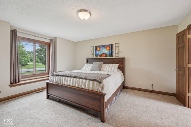 6983 White Oak Dr, Avon, IN 46123 - bedroom with light colored carpet, baseboards, and a textured ceiling