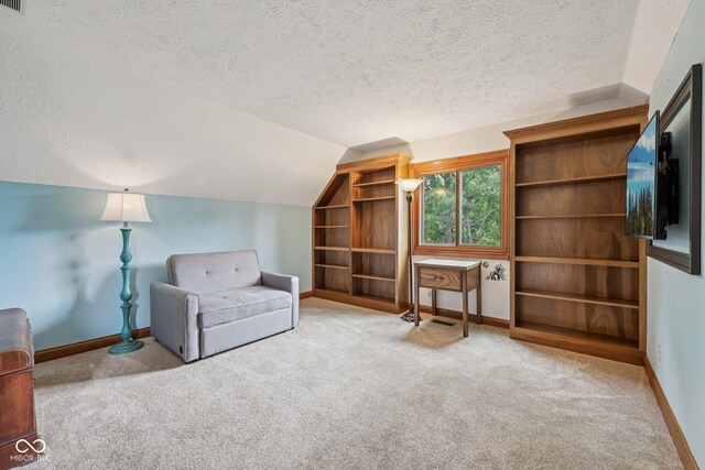 6983 White Oak Dr, Avon, IN 46123 - sitting room with a textured ceiling, carpet, vaulted ceiling, and baseboards