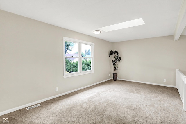 7430 Railway Ct, Indianapolis, IN 46256 - carpeted spare room featuring a skylight, baseboards, and beamed ceiling