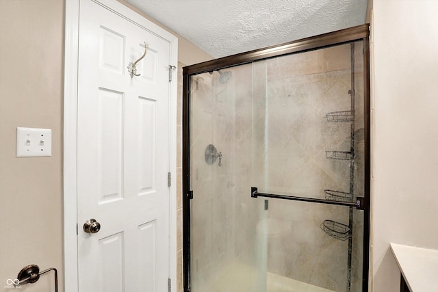 7430 Railway Ct, Indianapolis, IN 46256 - full bath featuring a stall shower and a textured ceiling