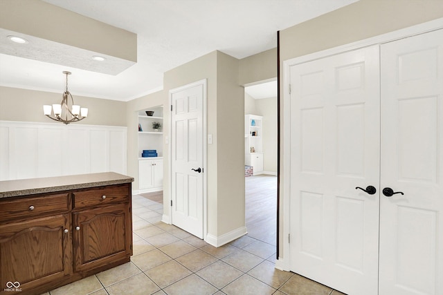 7430 Railway Ct, Indianapolis, IN 46256 - hall with light tile patterned flooring, a chandelier, and built in features