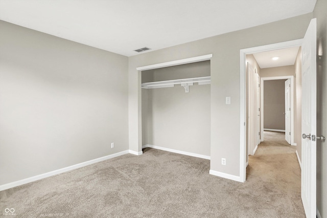 7430 Railway Ct, Indianapolis, IN 46256 - unfurnished bedroom featuring light carpet, baseboards, and a closet