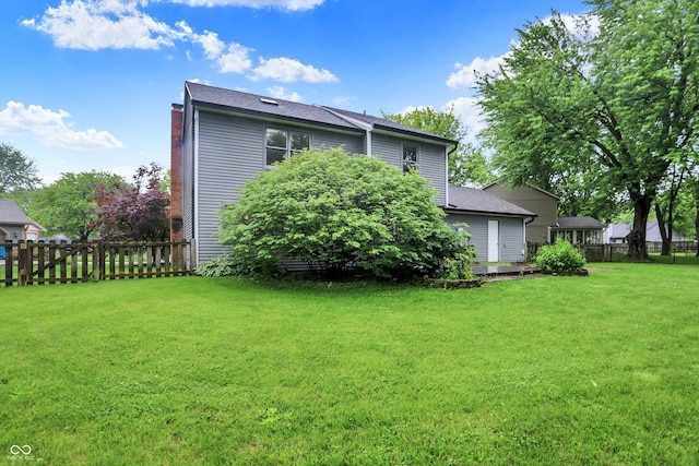 7430 Railway Ct, Indianapolis, IN 46256 - back of house featuring a shingled roof and a chimney