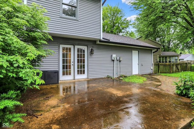 7430 Railway Ct, Indianapolis, IN 46256 - rear view of house with a patio, french doors, roof with shingles, and central AC unit