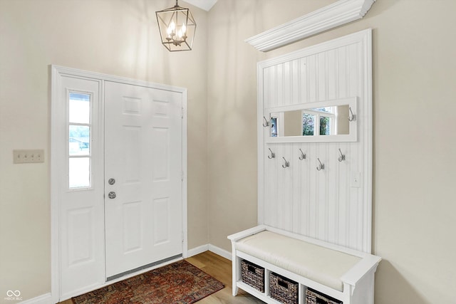 7430 Railway Ct, Indianapolis, IN 46256 - mudroom with a chandelier, baseboards, and wood finished floors