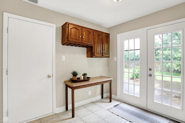 7430 Railway Ct, Indianapolis, IN 46256 - doorway to outside with baseboards, light tile patterned floors, and french doors