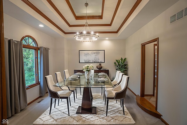 1188 Old Eagle Way, Greenwood, IN 46143 - dining room with a raised ceiling, a chandelier, ornamental molding, baseboards, and wood finished floors
