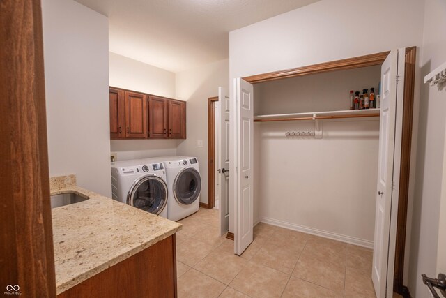 1188 Old Eagle Way, Greenwood, IN 46143 - laundry area with washer and dryer, cabinet space, light tile patterned floors, and baseboards
