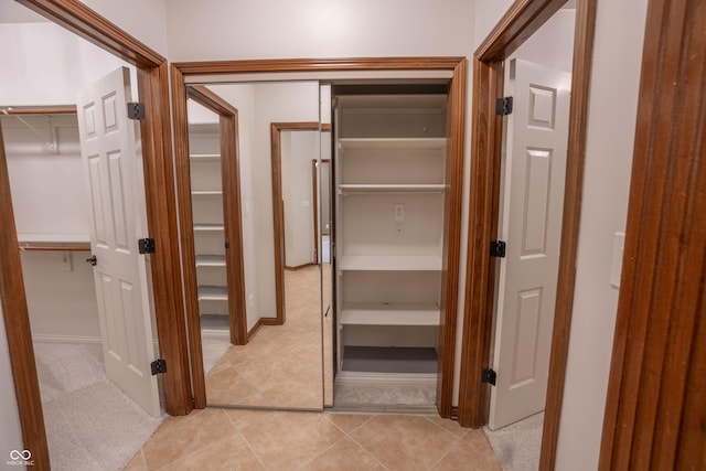 1188 Old Eagle Way, Greenwood, IN 46143 - hallway with light tile patterned floors and baseboards