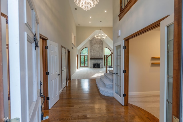 1188 Old Eagle Way, Greenwood, IN 46143 - foyer featuring a chandelier, a high ceiling, wood finished floors, baseboards, and recessed lighting
