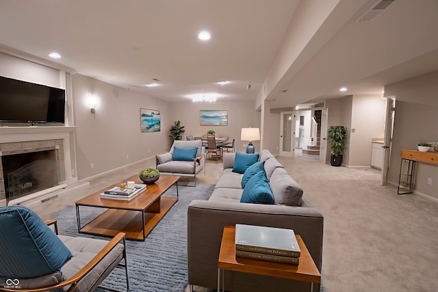 1188 Old Eagle Way, Greenwood, IN 46143 - carpeted living area with recessed lighting, a tiled fireplace, and baseboards