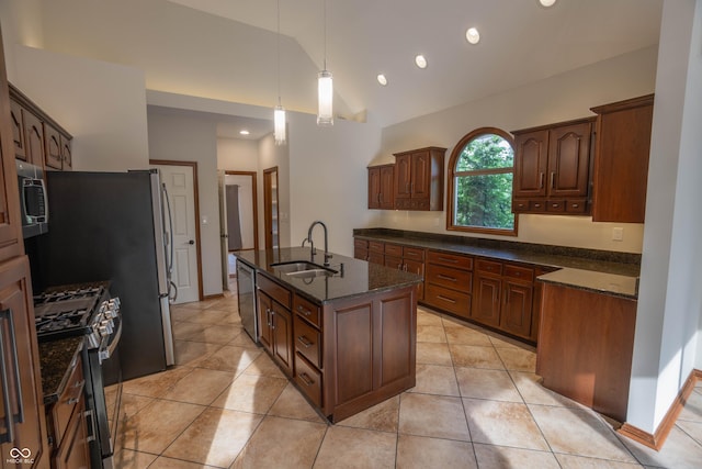 1188 Old Eagle Way, Greenwood, IN 46143 - kitchen with a sink, stainless steel appliances, a kitchen island with sink, lofted ceiling, and dark stone countertops
