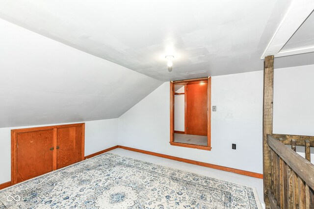 402 E 4th St, Sheridan, IN 46069 - additional living space featuring baseboards and vaulted ceiling