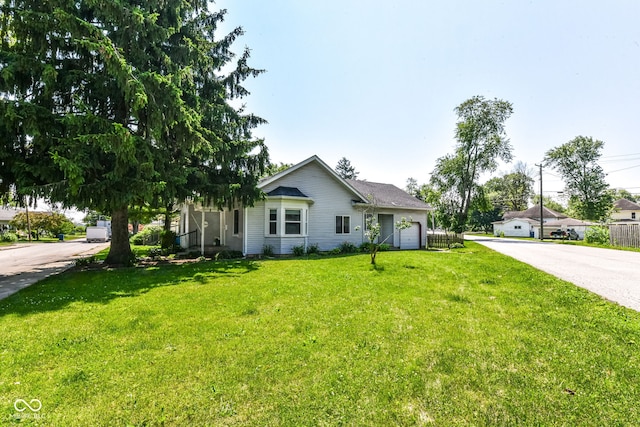 402 E 4th St, Sheridan, IN 46069 - ranch-style house with a garage, a front yard, and driveway
