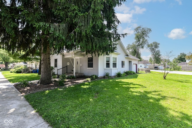 402 E 4th St, Sheridan, IN 46069 - view of front of property featuring an attached garage and a front yard