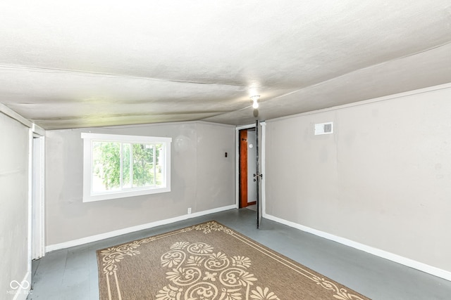 402 E 4th St, Sheridan, IN 46069 - spare room with vaulted ceiling and baseboards
