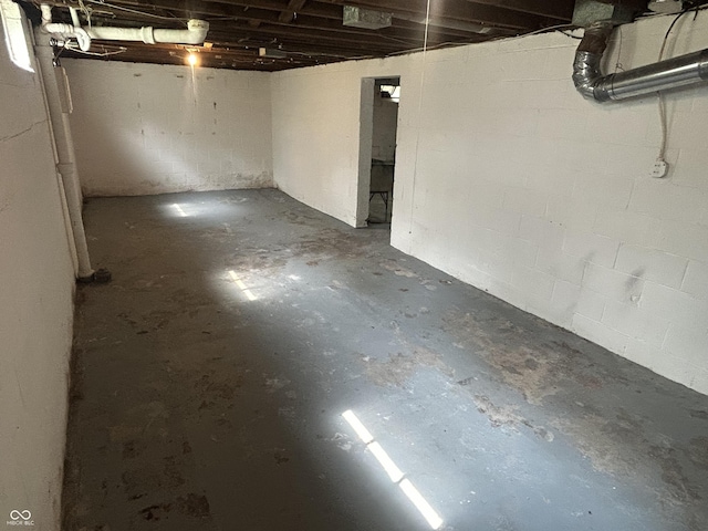 330 S Butler Ave, Indianapolis, IN 46219 - unfinished basement featuring concrete block wall