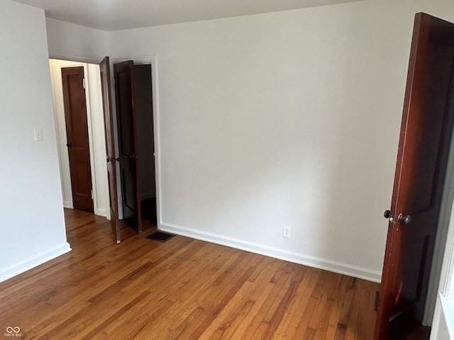 330 S Butler Ave, Indianapolis, IN 46219 - unfurnished room featuring light wood-type flooring and baseboards