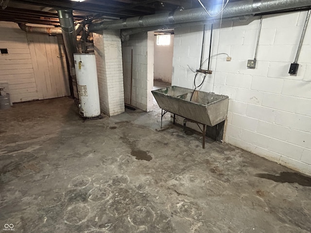 330 S Butler Ave, Indianapolis, IN 46219 - unfinished basement with gas water heater and a sink