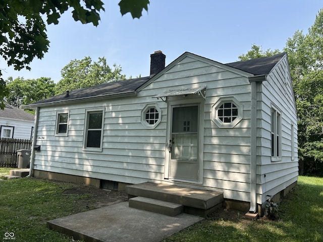 330 S Butler Ave, Indianapolis, IN 46219 - view of front of property with a chimney and a shingled roof