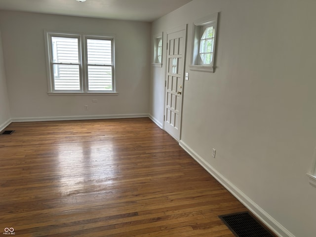330 S Butler Ave, Indianapolis, IN 46219 - empty room with dark wood-style floors and plenty of natural light