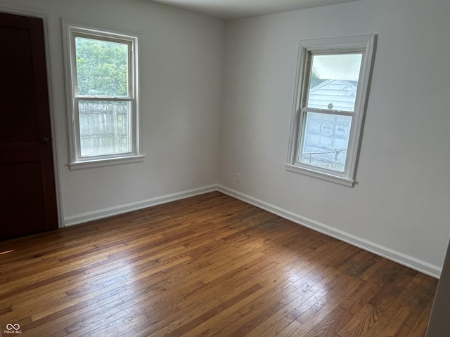 330 S Butler Ave, Indianapolis, IN 46219 - spare room with hardwood / wood-style flooring and baseboards