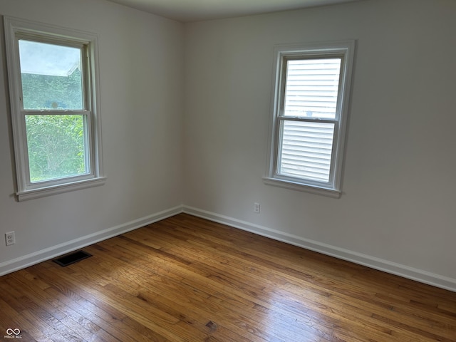 330 S Butler Ave, Indianapolis, IN 46219 - empty room with hardwood / wood-style floors and healthy amount of natural light
