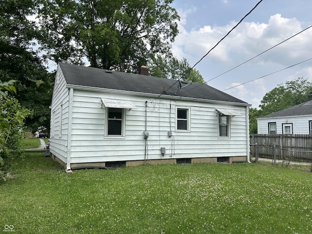 330 S Butler Ave, Indianapolis, IN 46219 - view of home's exterior featuring a chimney
