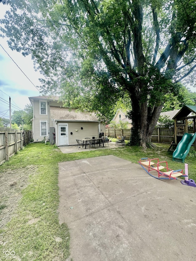 211 6th St, Covington, IN 47932 - view of yard with a patio area and a playground