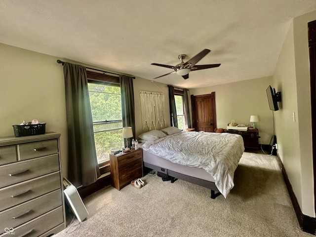 211 6th St, Covington, IN 47932 - carpeted bedroom with ceiling fan and baseboards