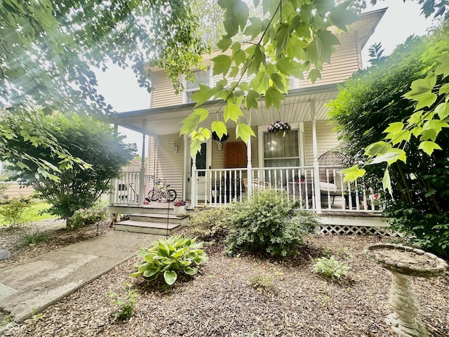 211 6th St, Covington, IN 47932 - view of front of property with a porch