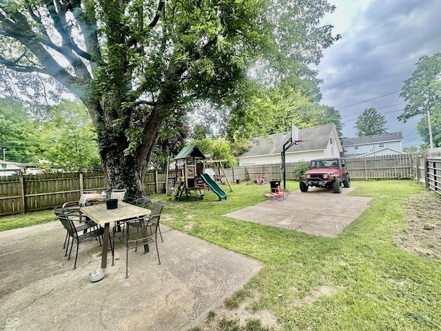 211 6th St, Covington, IN 47932 - view of yard with a patio area, a playground, and outdoor dining space