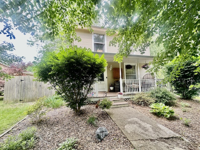 211 6th St, Covington, IN 47932 - obstructed view of property with covered porch