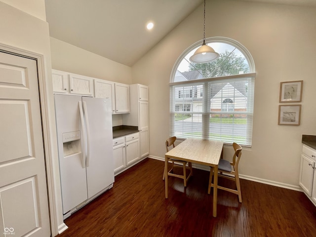 9664 Legare St Unit 2601, Fishers, IN 46038 - kitchen featuring white fridge with ice dispenser, white cabinets, dark countertops, high vaulted ceiling, and recessed lighting
